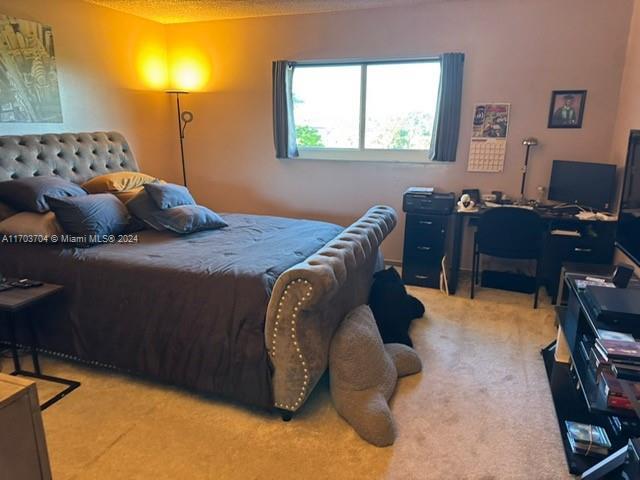 4750 NW 22nd Ct Unit 516, Lauderhill, FL 33313 - bedroom featuring carpet floors and a desk
