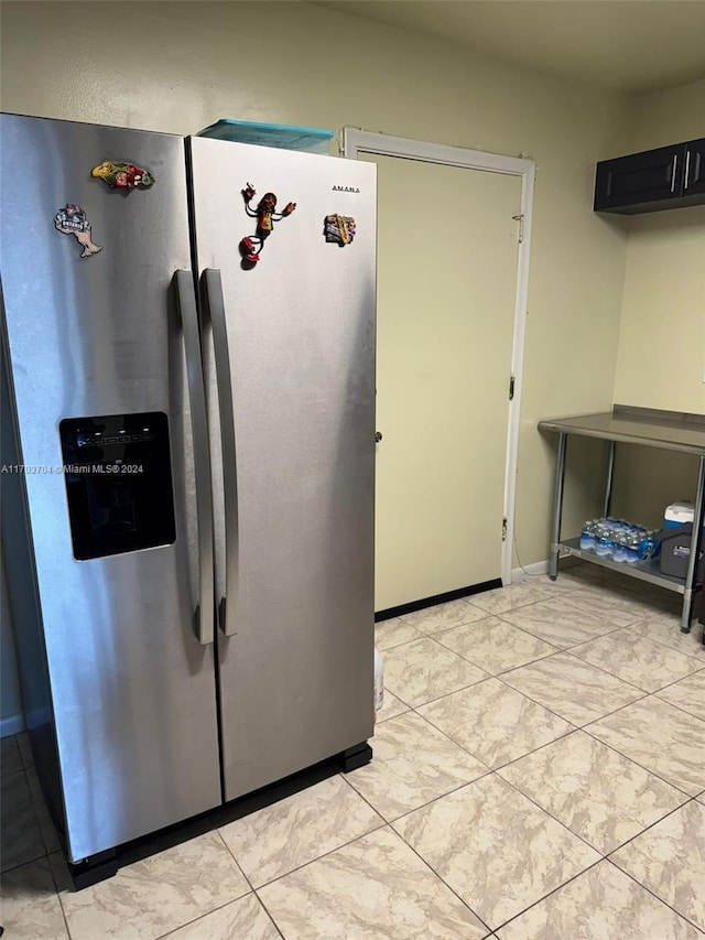 kitchen featuring stainless steel fridge with ice dispenser