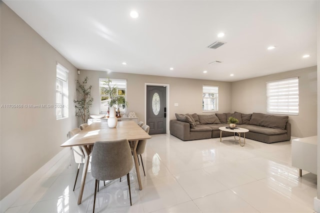 dining space featuring light tile patterned floors