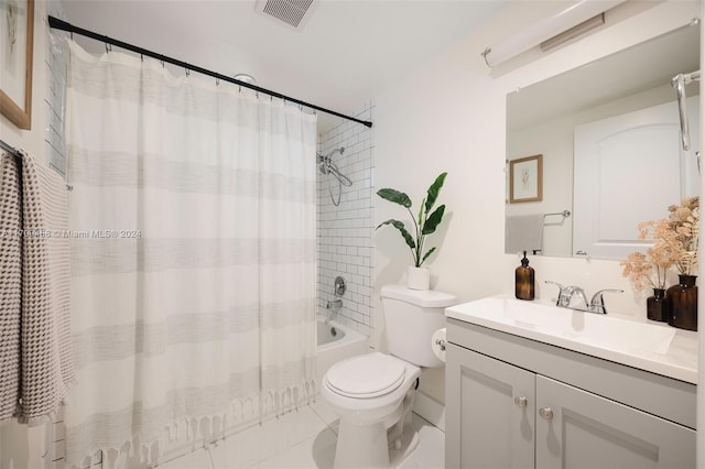 full bathroom featuring tile patterned flooring, vanity, shower / bath combination with curtain, and toilet