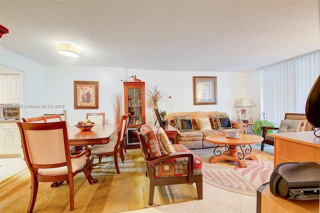 tiled living room with a textured ceiling