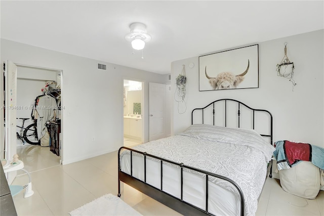 15400 SW 284th St Unit 1311, Homestead, FL 33033 - bedroom with a spacious closet, a closet, light tile patterned flooring, and ensuite bathroom