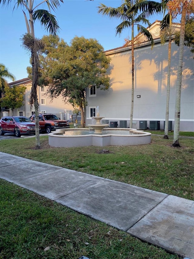 15400 SW 284th St Unit 1311, Homestead, FL 33033 - view of side of property featuring a yard