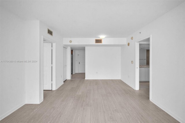 unfurnished room with light hardwood / wood-style floors