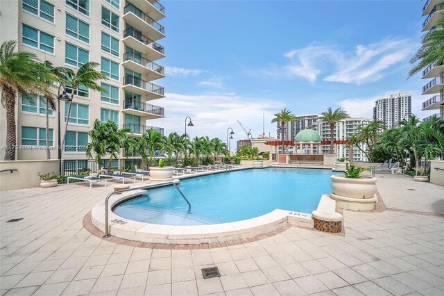 view of swimming pool with a patio area