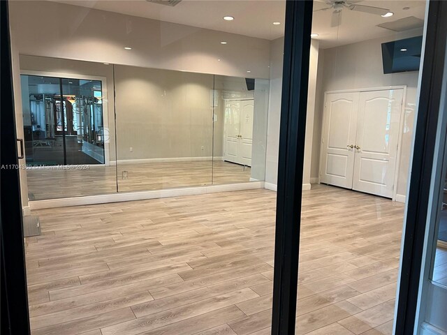 spare room featuring light hardwood / wood-style floors and ceiling fan