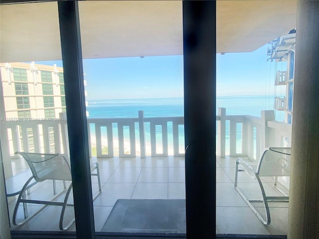 balcony with a view of the beach and a water view