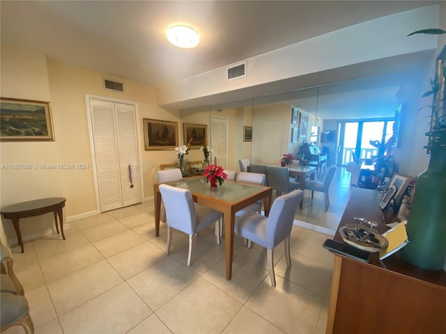 dining space with light tile patterned floors