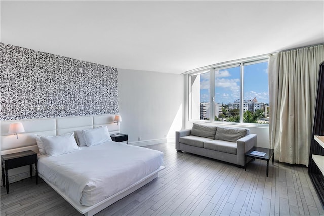 bedroom with wood-type flooring