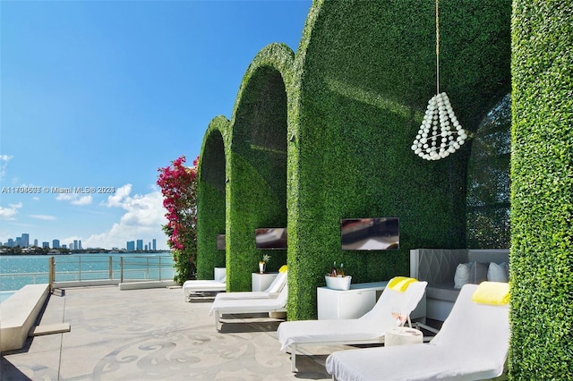 view of patio / terrace with a water view and an outdoor hangout area