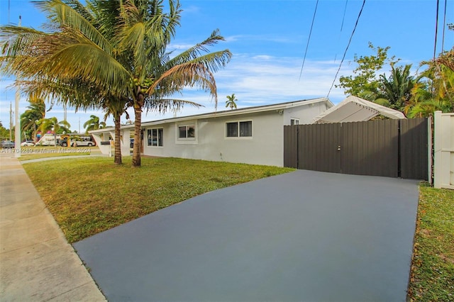 view of side of property with a lawn