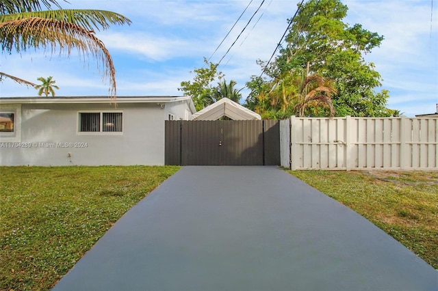 view of property exterior with a lawn