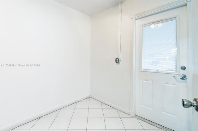 doorway to outside featuring light tile patterned floors