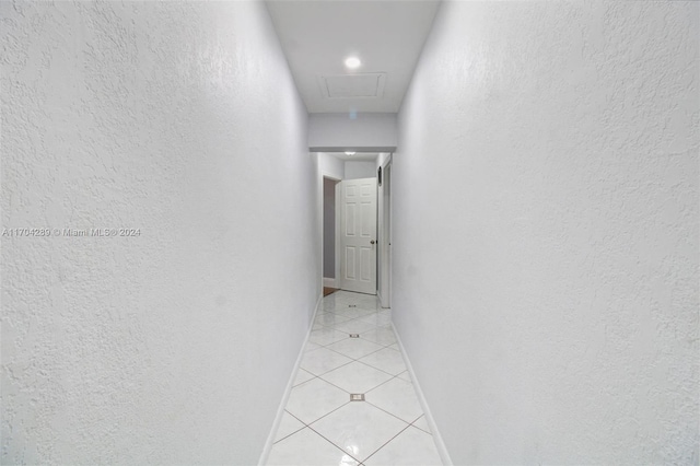 hallway featuring light tile patterned floors