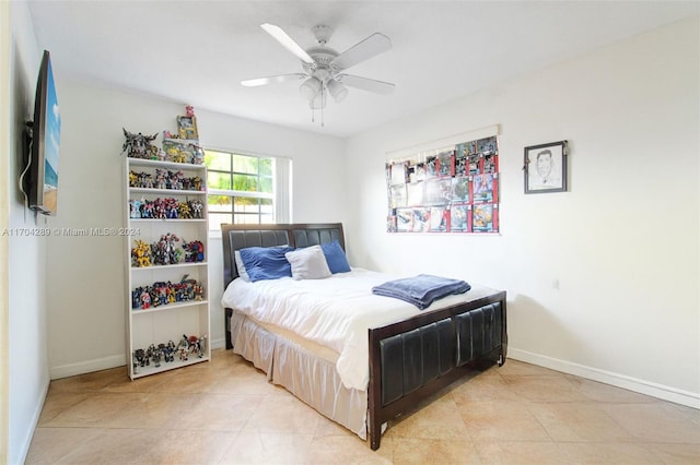 tiled bedroom with ceiling fan