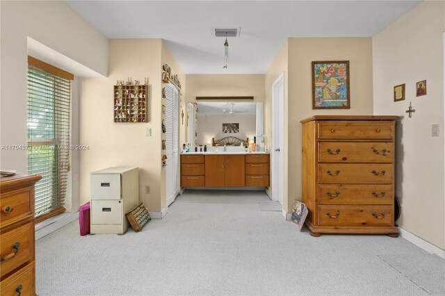 bathroom with ceiling fan and sink