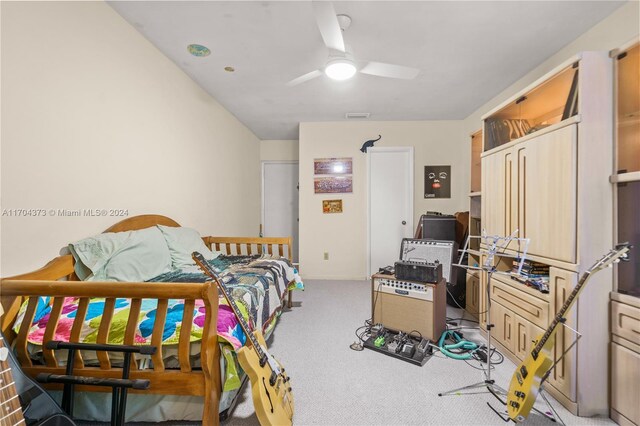 carpeted bedroom with a closet and ceiling fan