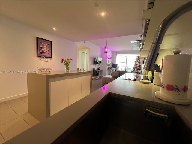 kitchen with recessed lighting, white cabinets, light tile patterned floors, black electric cooktop, and hanging light fixtures