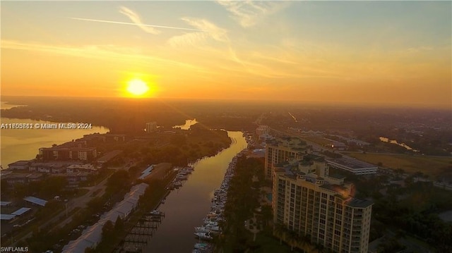 aerial view at dusk with a water view