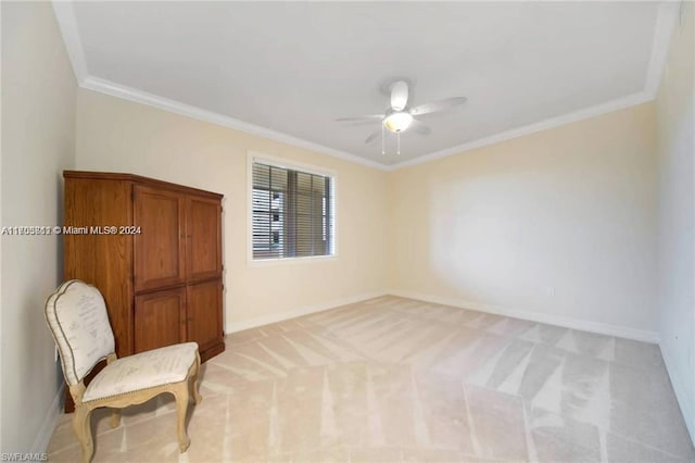 sitting room featuring light carpet, crown molding, and ceiling fan