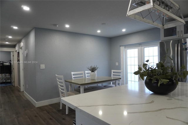 dining room featuring dark hardwood / wood-style flooring and french doors