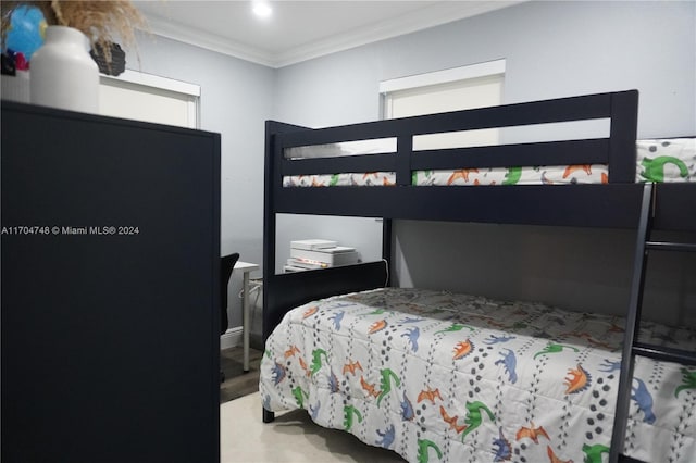 bedroom featuring wood-type flooring and crown molding