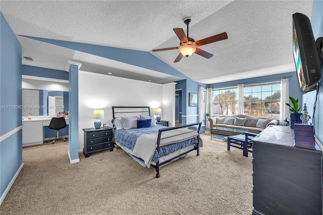 carpeted bedroom featuring a textured ceiling, ceiling fan, and lofted ceiling