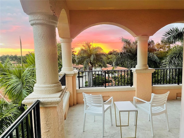 view of balcony at dusk