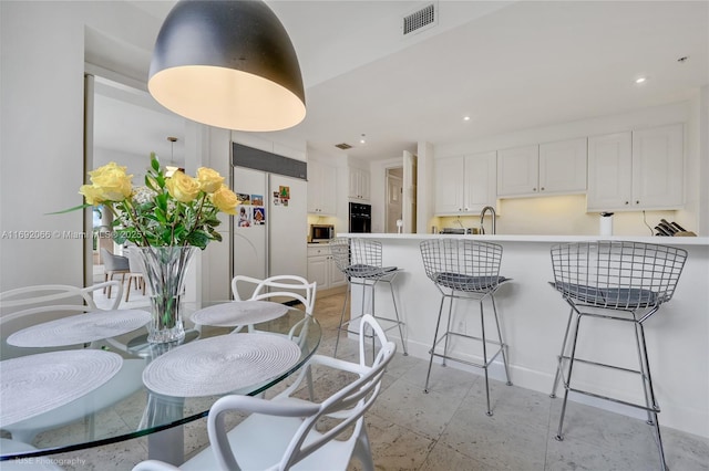 dining area featuring sink