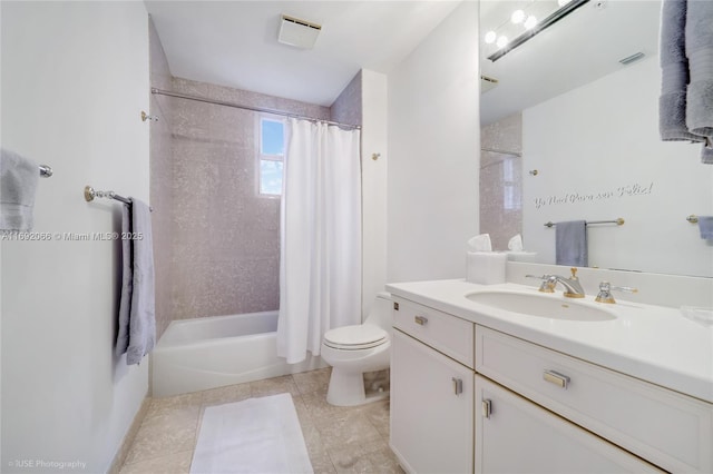 full bathroom with tile patterned flooring, shower / tub combo with curtain, vanity, and toilet