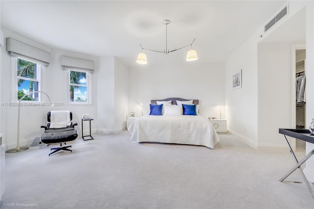 bedroom with light colored carpet