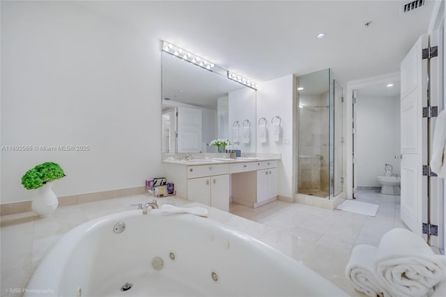 bathroom with vanity, independent shower and bath, and a bidet