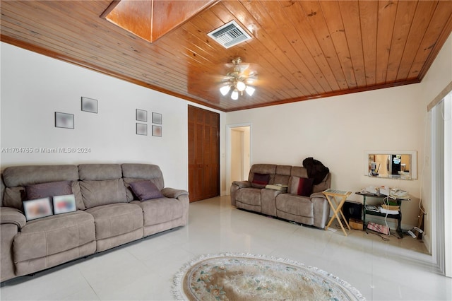 living room featuring ceiling fan, crown molding, light tile patterned floors, and wooden ceiling