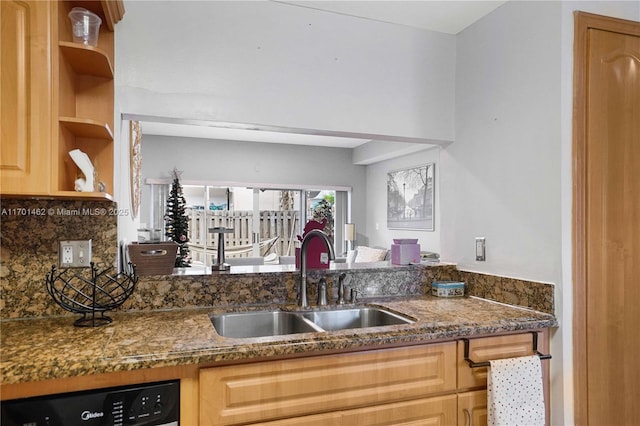 kitchen with dishwashing machine, sink, decorative backsplash, and dark stone countertops