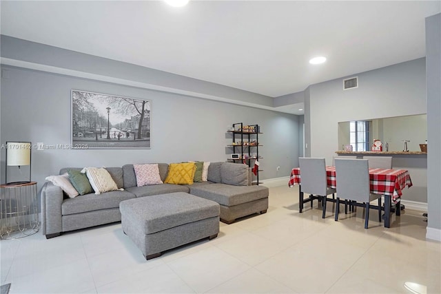 living room with light tile patterned flooring