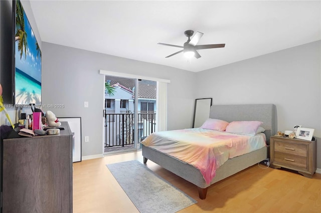 bedroom featuring access to exterior, ceiling fan, and light hardwood / wood-style flooring