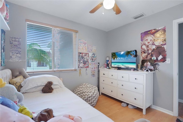 bedroom featuring ceiling fan and light hardwood / wood-style floors