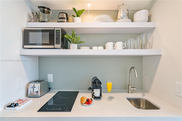 kitchen featuring sink and black electric stovetop