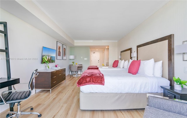 bedroom with light wood-type flooring