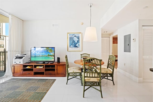 dining area with electric panel, light tile patterned floors, and expansive windows