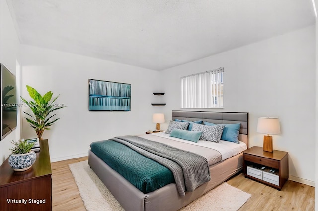 bedroom featuring light hardwood / wood-style floors