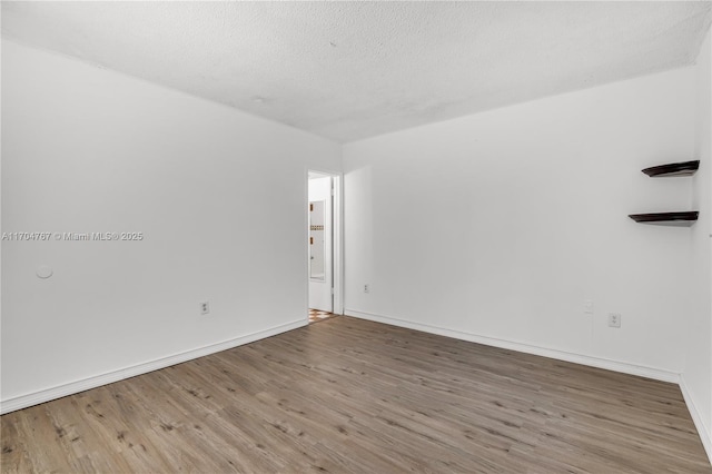 empty room featuring hardwood / wood-style floors