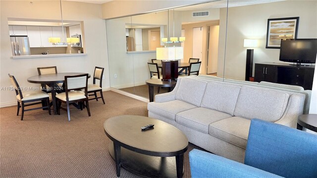 17375 Collins Ave Unit 2406, Sunny Isles Beach, FL 33160 - carpeted living room with baseboards