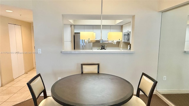 dining room with light tile patterned floors