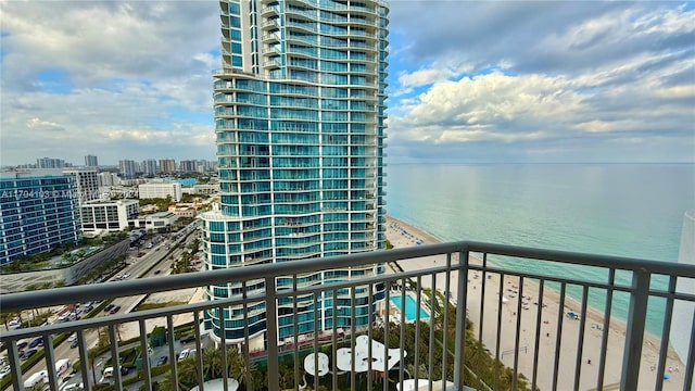 balcony with a view of the beach and a water view