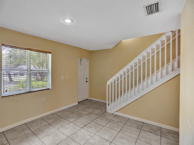 entryway with light tile patterned floors