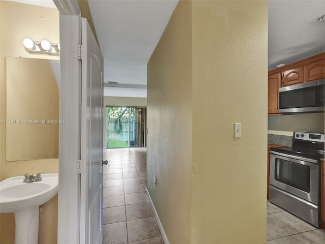 interior space with tile patterned flooring and sink