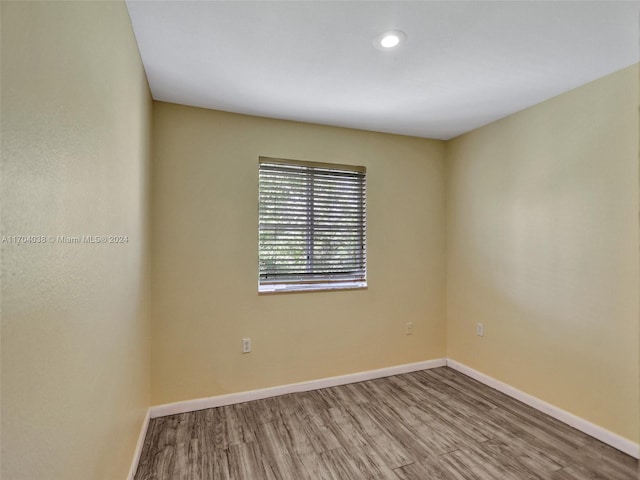 spare room with light wood-type flooring