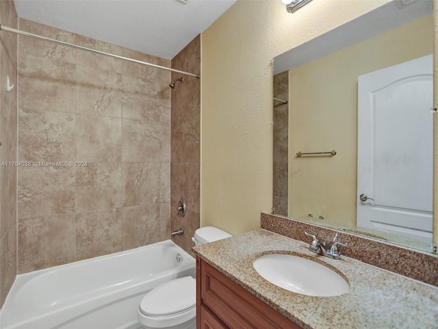 full bathroom with vanity, toilet, and tiled shower / bath