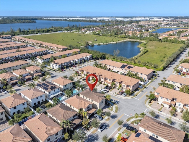 birds eye view of property featuring a water view